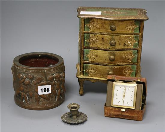A putti vase, a miniature chest, a clock and a candle holder